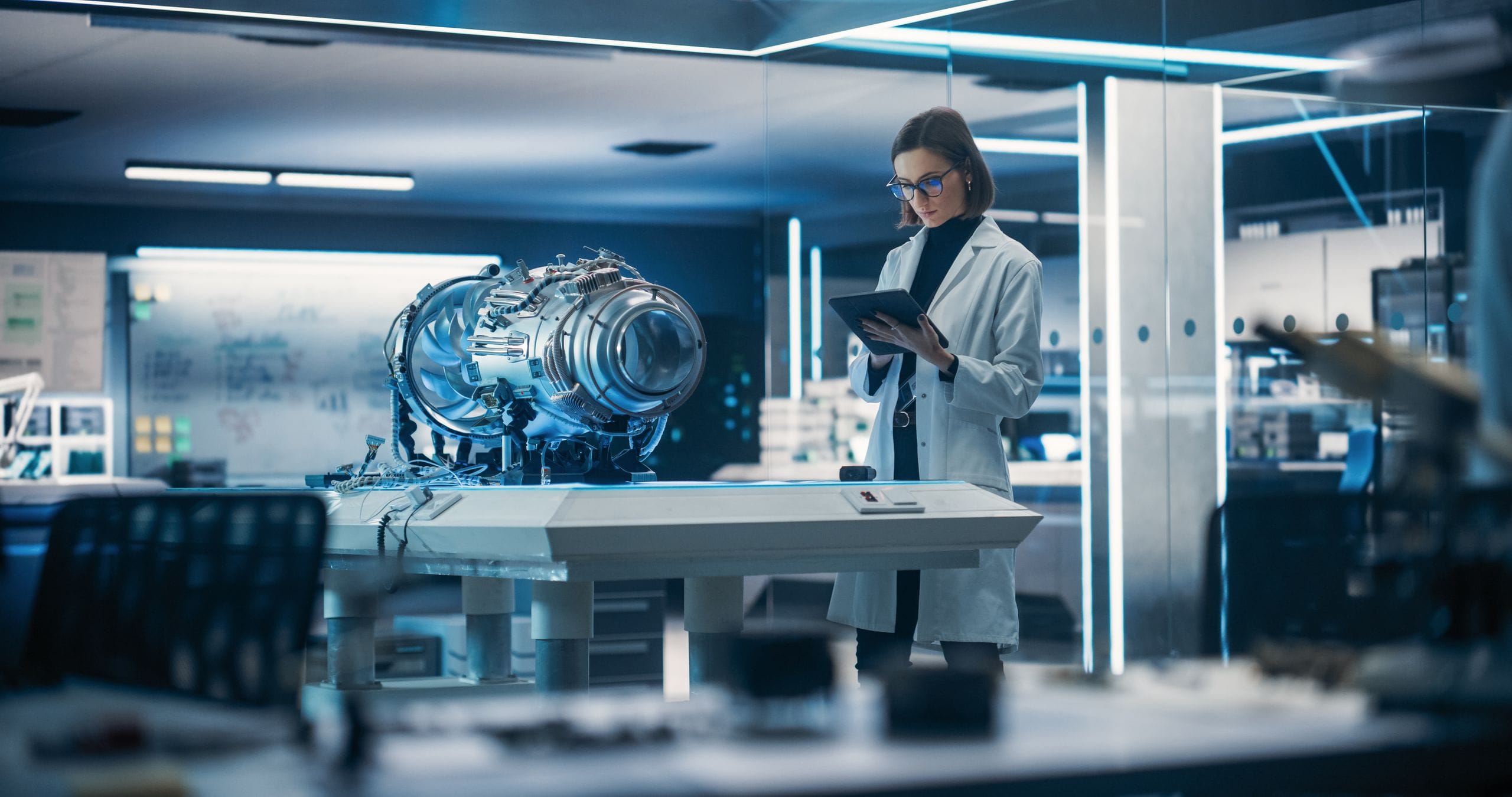 An engineer analysing a jet engine on the model