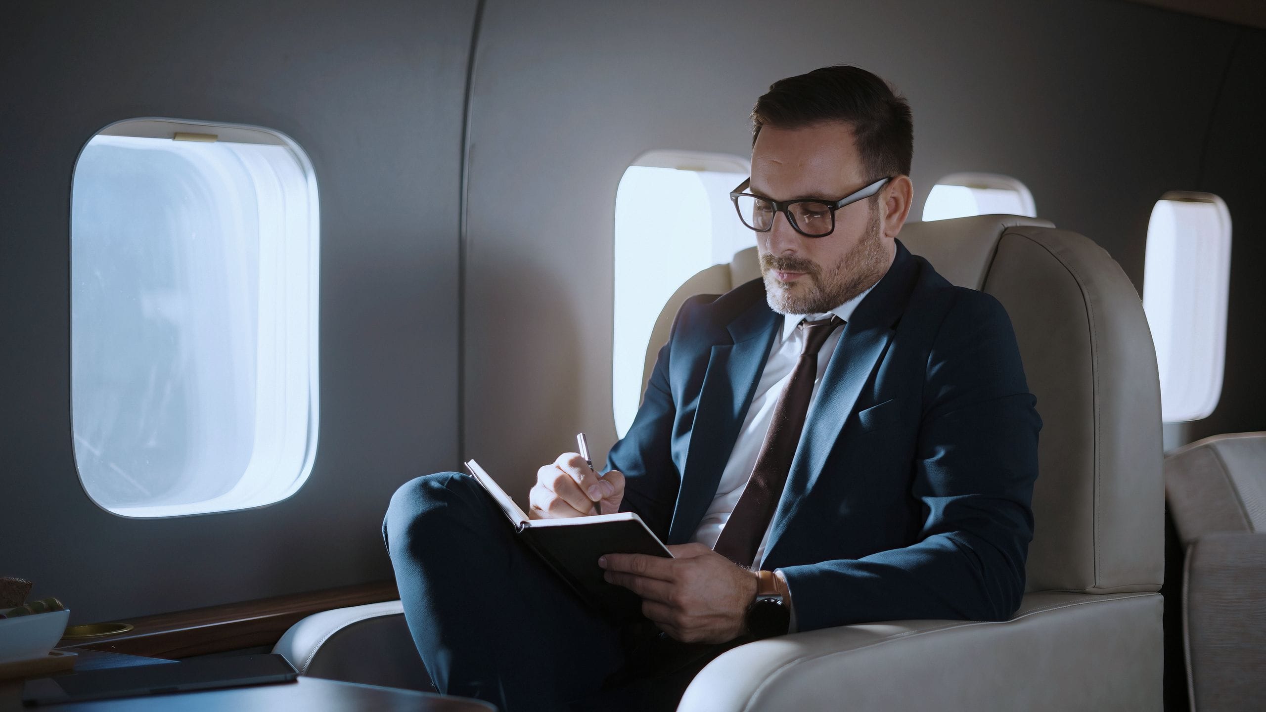 An executive reviewing a certification baseline in transit